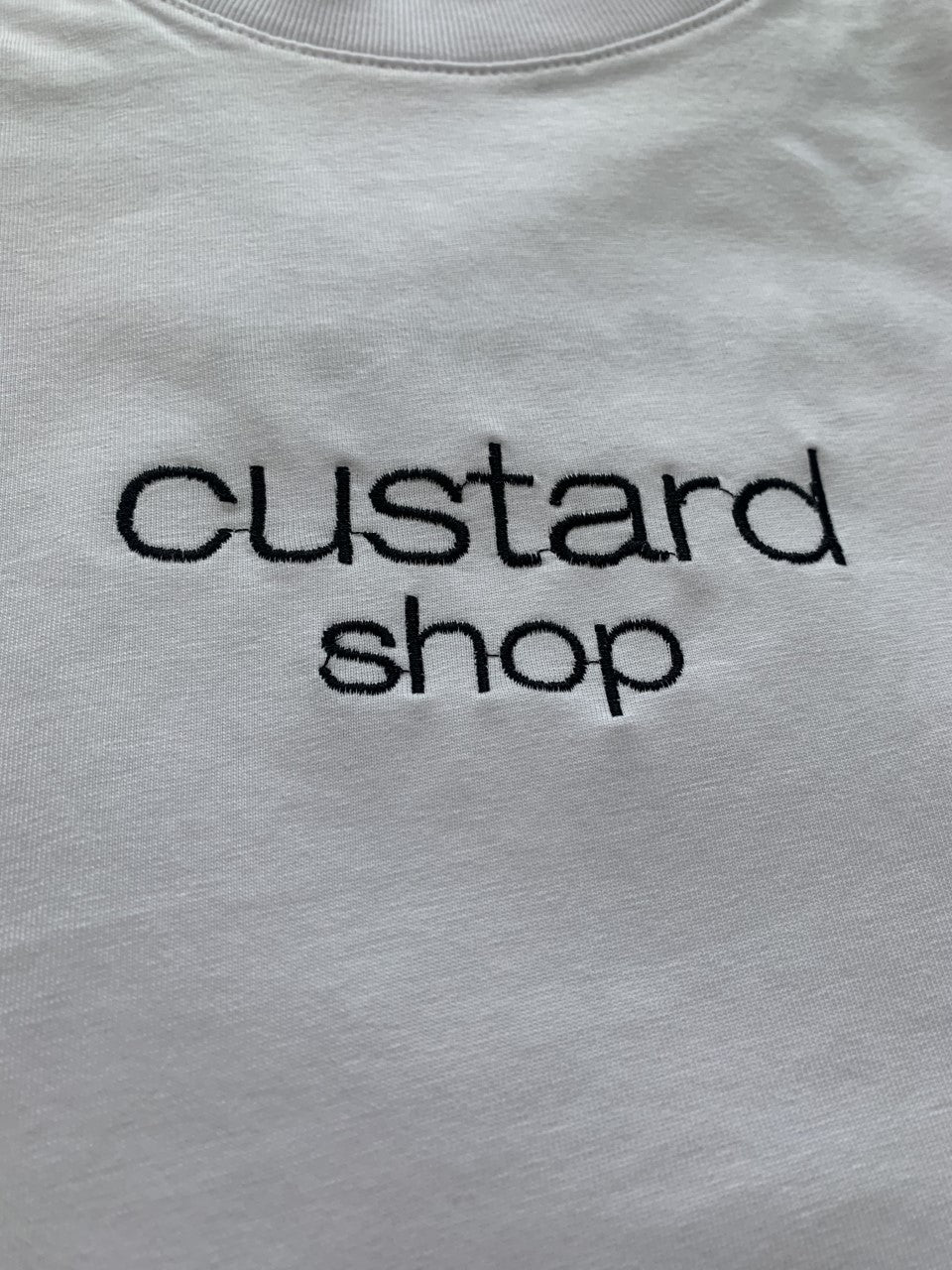 Custard Shop Official Embroidered Chest Logo | White Custard Shop Official